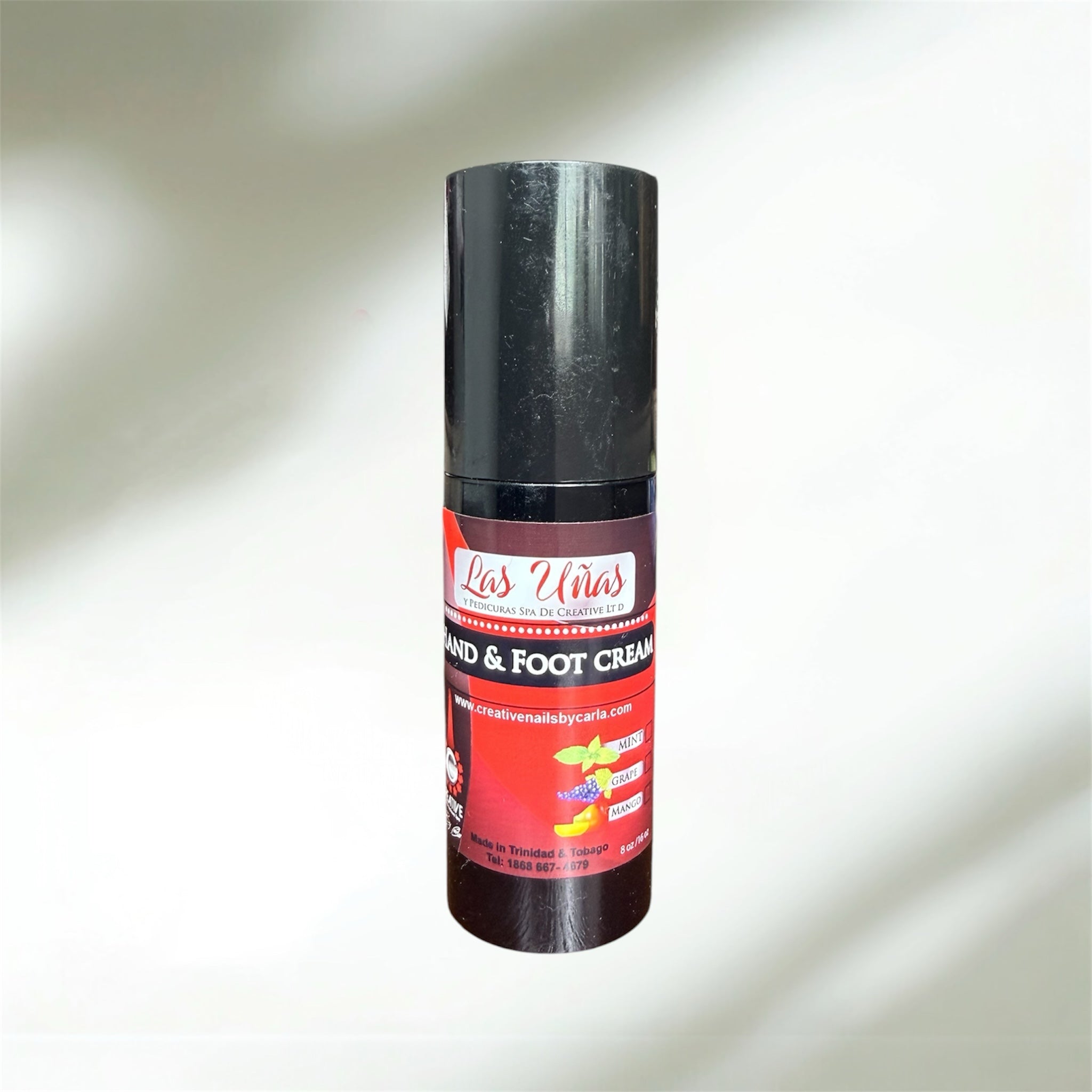Lasunas Pro’s Las Uñas hand and foot cream in a black pump bottle with red label featuring mint, grape, and mango scents.
